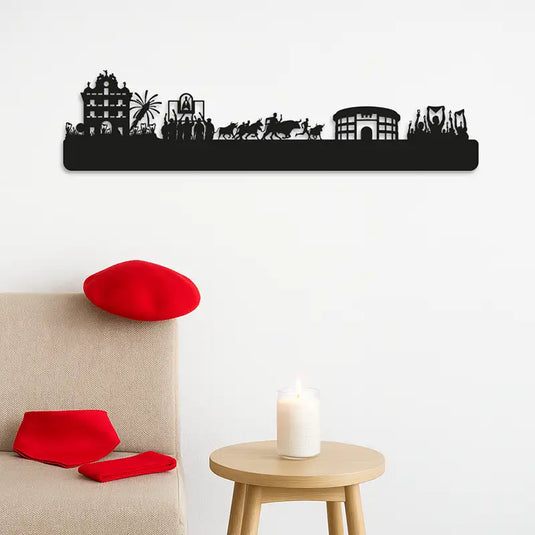 Silueta representa las fiestas de san fermin, desde el chupinazo en la plaza del ayuntamiento, el canto de los corredores a la hornacina de San Fermín, el encierro hasta la plaza de toros y el "pobre de mi" final