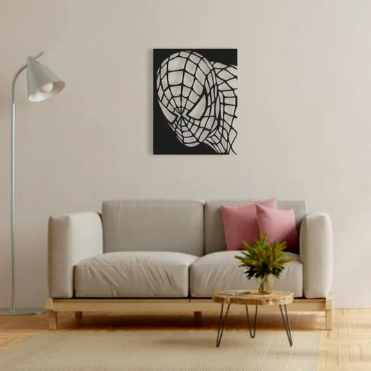 Cuadro de Spiderman en aluminio recortado sobre pared beige en salón moderno con sofá claro