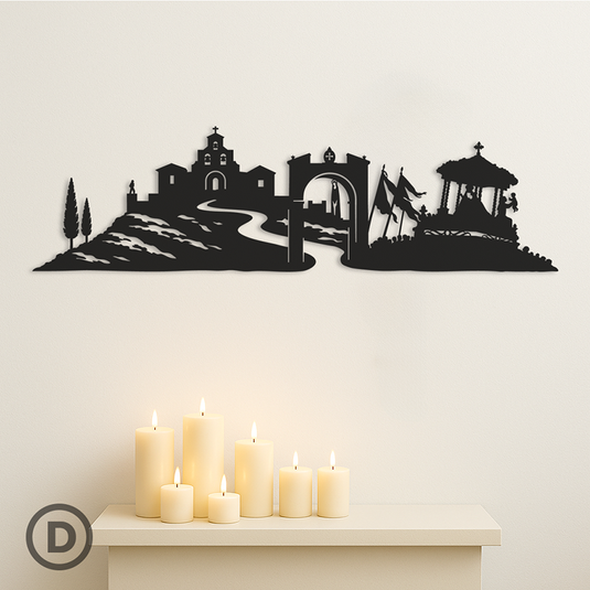 Skyline Virgen de la Cabeza en metal negro decorativo colocado sobre pared blanco roto, pieza ideal para decoración de romería y ambiente andaluz.